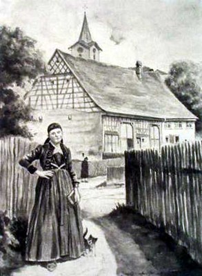 Frau in Tracht mit Gebetbuch